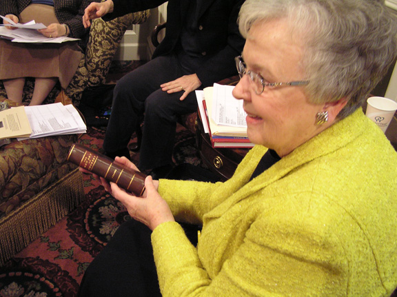 Jean Robbins holding rare book