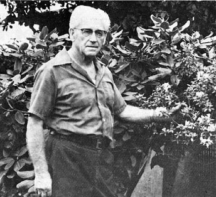Cy Ward with some of the large plants at his nursery