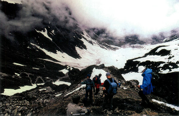The expedition party about to descend 
into the third cirque on the Pemako side of the Doshong La.