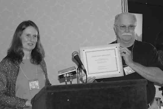 Kristine Johnson gives Jim Brant a 
certificate recognizing ARS contributions to the National Park.
