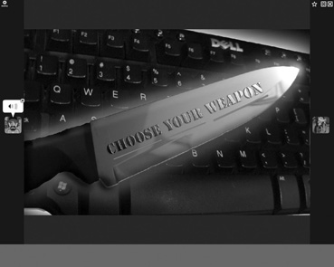 A knife with the words 'Choose Your Weapon' on it being held over a keyboard.