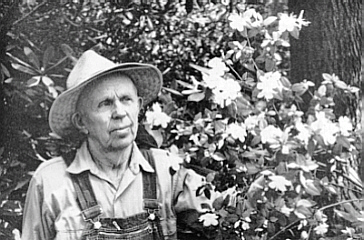 Mr. Gable looking over flowers of R. ovatum