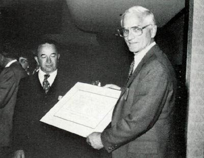 George Ring left, presents award to Fred Galle