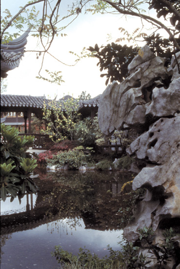 Reflected scene near Pavilion showing 
typical upturned roof and phantasmagoric rock